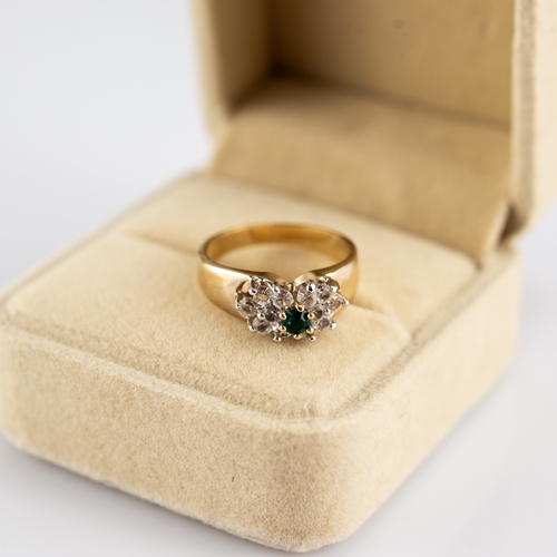 150 - 18k GOLD, EMERALD AND DIAMOND CLUSTER RING, set with small round emerald with surround of six small ... 