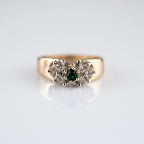 150 - 18k GOLD, EMERALD AND DIAMOND CLUSTER RING, set with small round emerald with surround of six small ... 