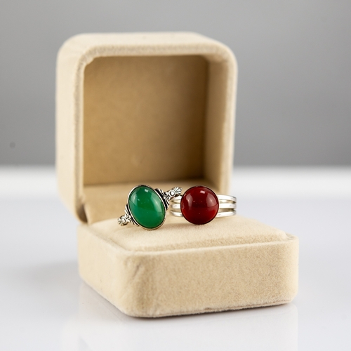 154 - SILVER RING, collet set with a green oval cabochon and a SILVER TRIPLE STRAND RING set with an amber... 