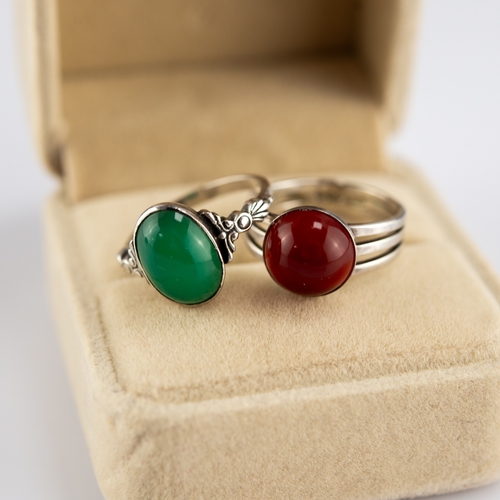 154 - SILVER RING, collet set with a green oval cabochon and a SILVER TRIPLE STRAND RING set with an amber... 