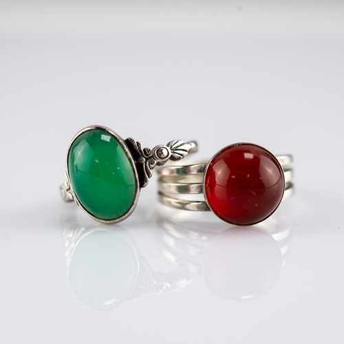 154 - SILVER RING, collet set with a green oval cabochon and a SILVER TRIPLE STRAND RING set with an amber... 