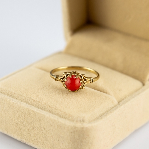 156 - 9ct GOLD RING, claw set with a cabochon circular coral, 1.3gms