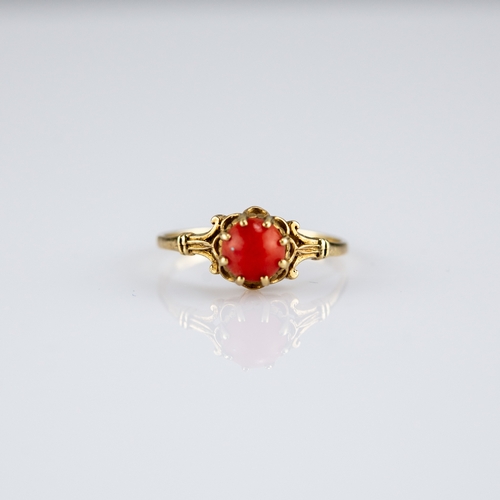 156 - 9ct GOLD RING, claw set with a cabochon circular coral, 1.3gms