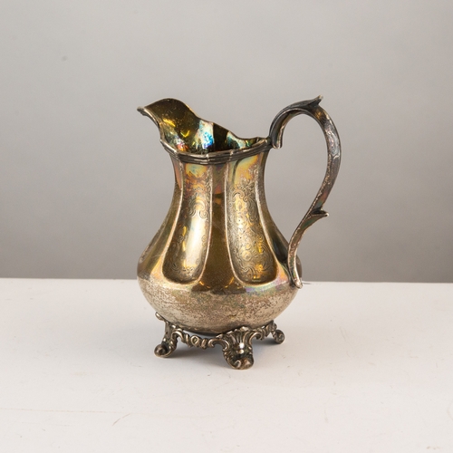 290 - VICTORIAN ENGRAVED SILVER MILK JUG, of baluster form with deep flutes, high scroll handle and scroll... 