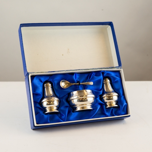 294 - CASED THREE PIECE MODERN SILVER CONDIMENT SET AND SPOON, the open mustard with blue glass liner, Bir... 