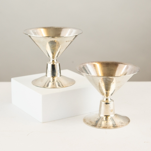 299 - STYLISH MODERN PAIR OF PLANISHED SILVER PEDESTAL CANDLE HOLDERS BY ROBERT WELCH, each of conical for... 