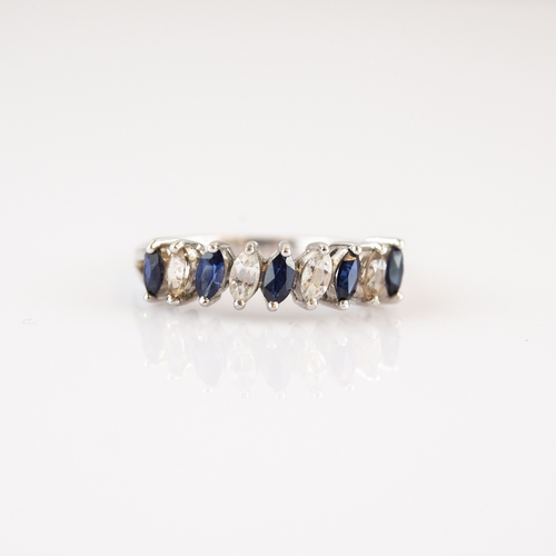 64 - 9ct WHITE GOLD RING set with five marquise cut blue sapphires, alternating with four marquise cut wh... 