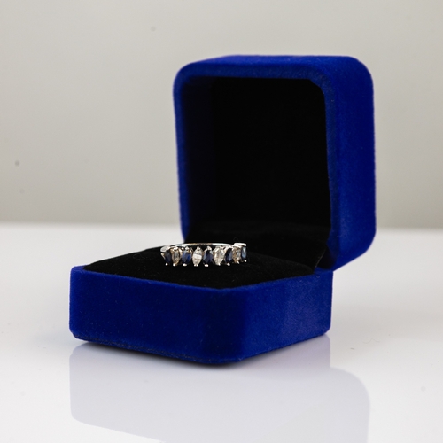 64 - 9ct WHITE GOLD RING set with five marquise cut blue sapphires, alternating with four marquise cut wh... 