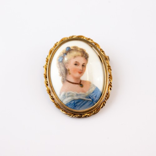 237 - OVAL SHELL CAMEO BROOCH, carved with a classical female head, collet set in a 9ct gold frame with go... 