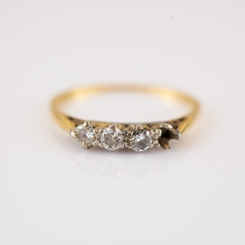 238 - 18ct GOLD AND PLATINUM RING, claw set with a row of three small, round, brilliant cut diamonds, ring... 