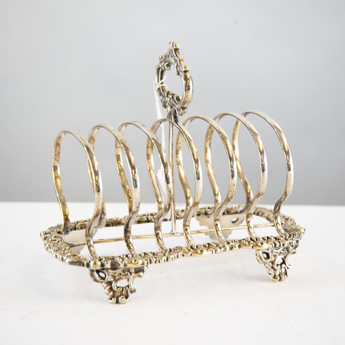 370 - VICTORIAN ELECTROPLATED LARGE TOAST RACK, with top handle, foliate embossed border and scroll feet, ... 