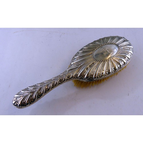 318 - VICTORIAN EMBOSSED SILVER CASED DRESSING TABLE HAIR BRUSH, initialled, London 1892