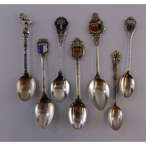 276 - FIVE SILVER COLOURED METAL (800 mark) SOUVENIR TEASPOONS, four with enamel tops, together with TWO O... 