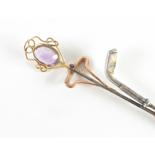 695 - EARLY 20TH CENTURY GILT METAL HAT PIN, the open wirework top set with a large oval amethyst; ANOTHER... 