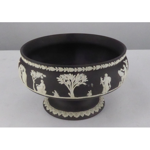 68 - WEDGWOOD BLACK JASPERWARE PEDESTAL FRUIT BOWL, sprigged in white with classical figures within stiff... 