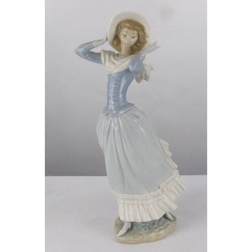 75 - LLADRO PORCELAIN FIGURE OF YOUNG LADY HOLDING HER BRIMMED HAT and with her white scarf blowing backw... 