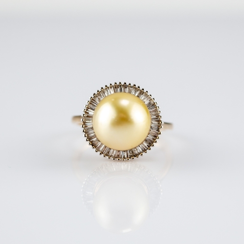 137 - 9k GOLD RING set with a centre large cultured pearl surmounting a radiating surround of small baguet... 