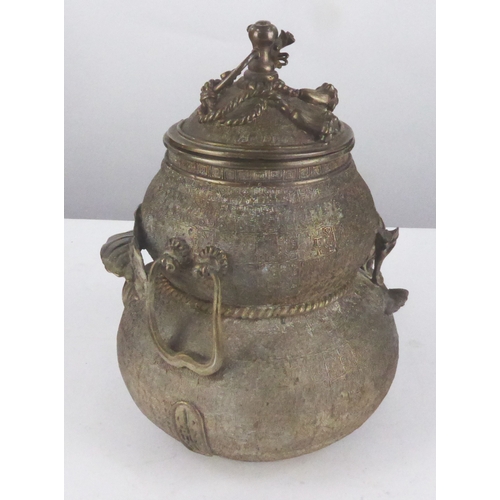 94 - ORIENTAL BRONZE JAR AND COVER, of double gourd form with fixed handle to the rear and similar cast f... 