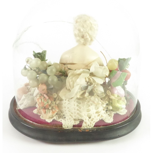 519 - EARLY 20th CENTURY DISPLAY UNDER OVAL GLASS DOME OF PIN CUSHION FIGURE AND TINY CERAMIC DOLLS HOUSE ... 