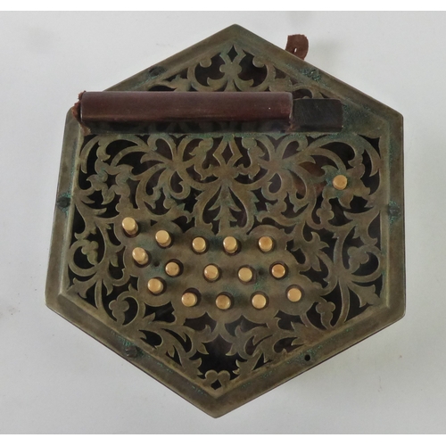 33 - LATE 19TH/EARLY 20TH CENTURY CONCERTINA OF TYPICAL CONSTRUCTION having foliate scroll cut card pierc... 