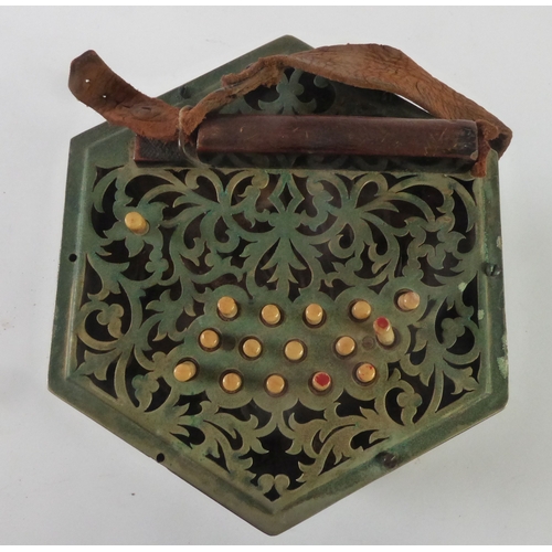 33 - LATE 19TH/EARLY 20TH CENTURY CONCERTINA OF TYPICAL CONSTRUCTION having foliate scroll cut card pierc... 