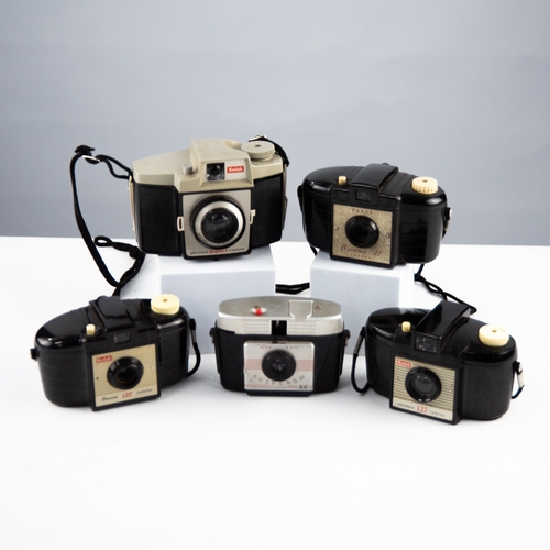 66 - THREE KODAK BROWNIE 127 CAMERAS; and a BROWNIE CRESTA 3 CAMERA; and a SIMILAR AGIFLASH 44 CAMERA (a/... 