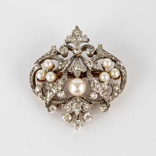 25 - LATE VICTORIAN GOLD AND PLATINUM DIAMOND AND PEARL OPEN WORK BROOCH/PENDANT, with removable pin fast... 