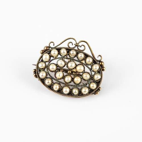 30 - VICTORIAN GOLD FRAMED AND TWISTED WIRE OVAL BROOCH, set with 24 small pearls, 1in (2.5cm) wide, toge... 