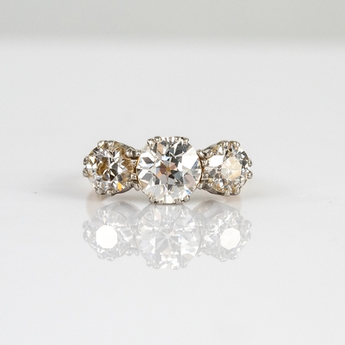 43 - 18ct GOLD AND THREE STONE DIAMOND RING, the graduated old brilliant cut diamonds in double claw sett... 