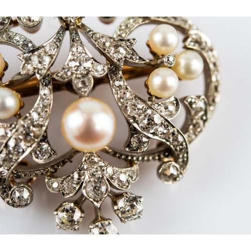 25 - LATE VICTORIAN GOLD AND PLATINUM DIAMOND AND PEARL OPEN WORK BROOCH/PENDANT, with removable pin fast... 