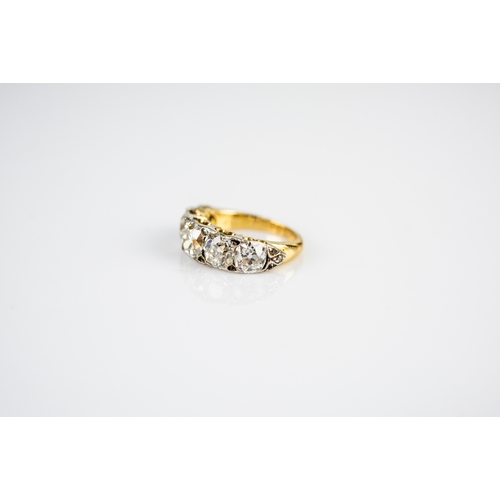 42 - LATE VICTORIAN FIVE STONE DIAMOND RING, the graduated cushion shaped old brilliant cut diamonds, pai... 