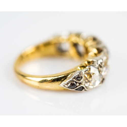 42 - LATE VICTORIAN FIVE STONE DIAMOND RING, the graduated cushion shaped old brilliant cut diamonds, pai... 