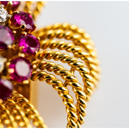 46 - GOLD, DIAMOND AND RUBY BROOCH of irregular whorl pattern with numerous wirework twisted strands eman... 