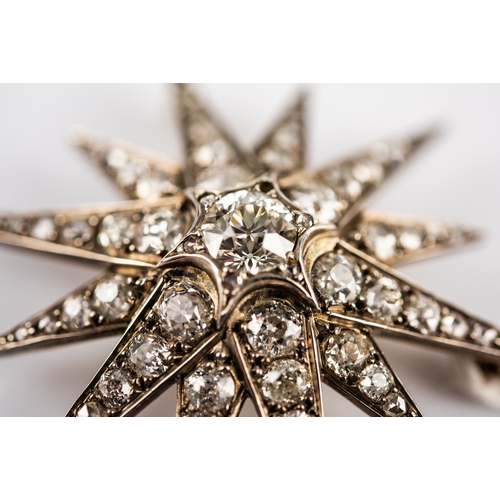 48 - VICTORIAN DIAMOND STAR BROOCH/PENDANT, the twelve point star has a centre round old cut diamond appr... 