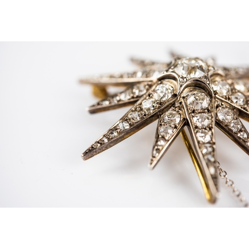 48 - VICTORIAN DIAMOND STAR BROOCH/PENDANT, the twelve point star has a centre round old cut diamond appr... 