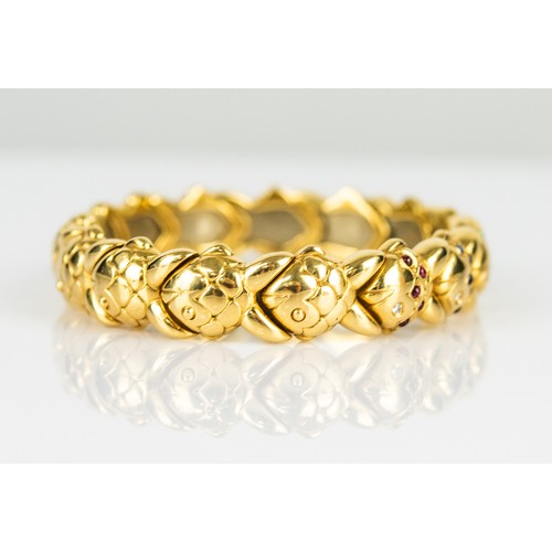 49 - 18ct GOLD SPRUNG BANGLE with fifteen fish pattern links, the top five links set with tiny diamonds, ... 