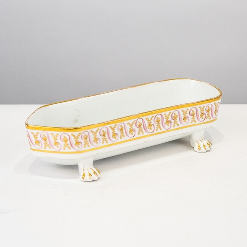 91 - EARLY NINETEENTH CENTURY WEDGWOOD PORCELAIN BOAT-SHAPE DESK TOP PEN RECEIVER on four lion-paw feet, ... 