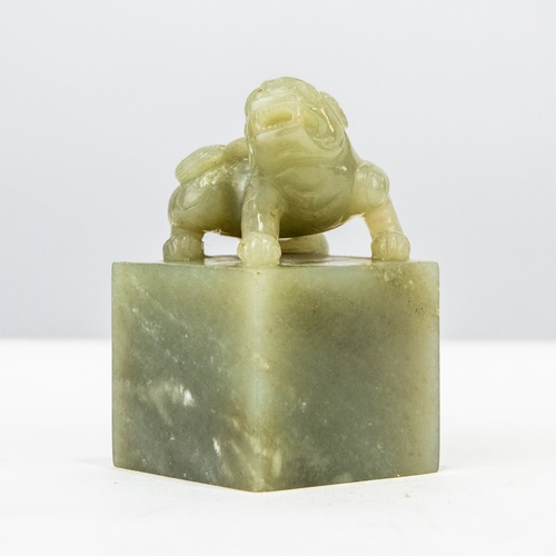 111 - CHINESE PROBABLY QING DYNASTY PALE CELADON JADE SEAL, surmounted with a BUDDHISTIC LION without char... 