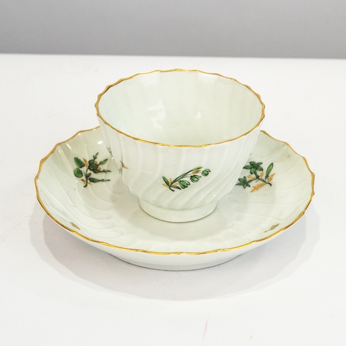 65 - FLIGHT & BARR PORCELAIN TEA BOWL AND SAUCER, of wrythen fluted form, painted in green, black and... 