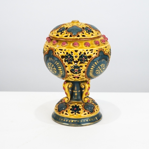 104 - ZOLNAY PECS PIERCED POTTERY PEDESTAL POT POURRI JAR AND COVER, with four scroll supports enclosing t... 