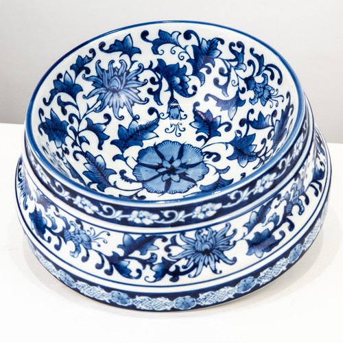 106 - TWO MODERN BLUE AND WHITE POTTERY DOG BOWLS, one, a LIMITED EDITION BY SPODE, of serpentine outline ... 