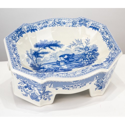 106 - TWO MODERN BLUE AND WHITE POTTERY DOG BOWLS, one, a LIMITED EDITION BY SPODE, of serpentine outline ... 