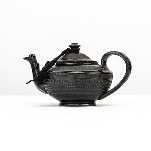 80 - LATE EIGHTEENTH CENTURY BLACK GLAZED ‘JACKFIELD’ SMALL TEAPOT, with engine turned borders, 3 ½” (8.9... 