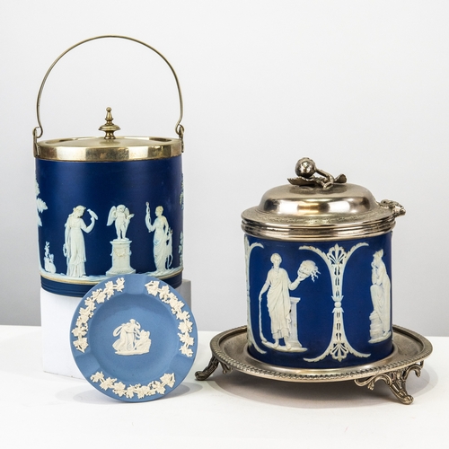 75 - TWO WEDGWOOD BLUE DIPPED JASPERWARE POTTER BISCUIT BARRELS WITH COVERS, both applied in white with c... 