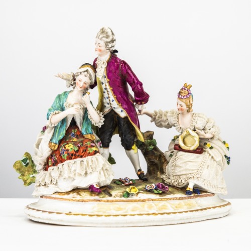 76 - NINETEENTH CENTURY DRESDEN LACE PORCELAIN GROUP, modelled as two ladies and a gentleman, on a shaped... 