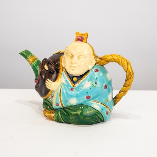 77 - MINTON ‘CHINAMAN’ MAJOLICA POTTERY TEAPOT AND COVER, 6 ¼” (15.9cm) high, indistinct impressed mark a... 