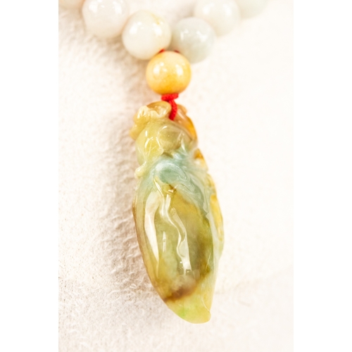 16 - JADE NECKLACE formed of 63 WHITE JADE BEADS, suspending a CARVED VARIEGATED GREEN JADE CICADA INSECT... 