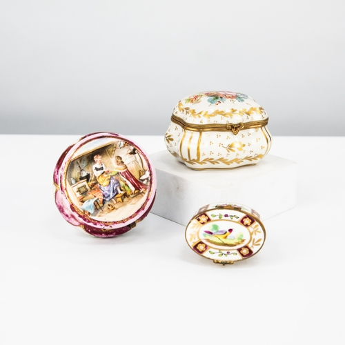 107 - THREE TWENTIETH CENTURY FRENCH PORCELAIN AND GILT METAL MOUNTED TRINKET BOXES, including two, hand p... 