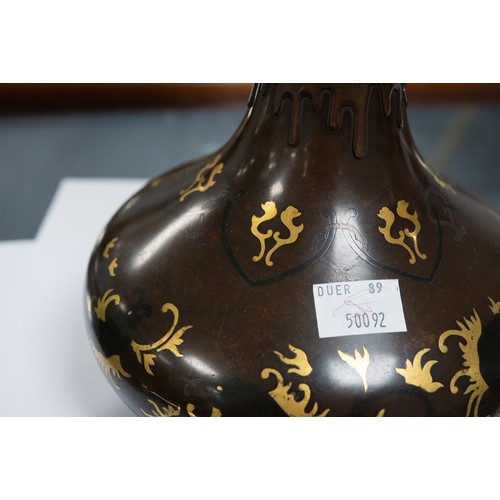 71 - GOOD QUALITY JAPANESE MEIJI PERIOD PARCEL GILT TWO HANDLED BRONZE VASE, of footed form with bird mas... 