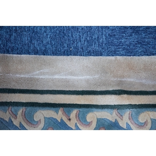 6 - LARGE WASHED CHINESE CARPET of Aubusson design, having large floral centre oval medallion, spandrels... 